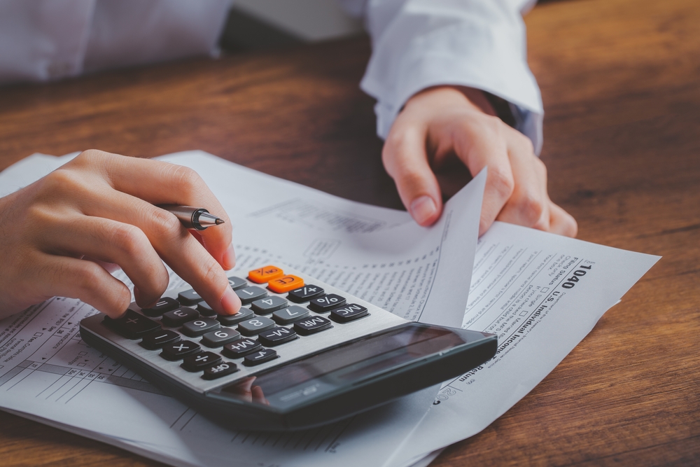 Employer calculating the overall cost of hiring a maid in Singapore